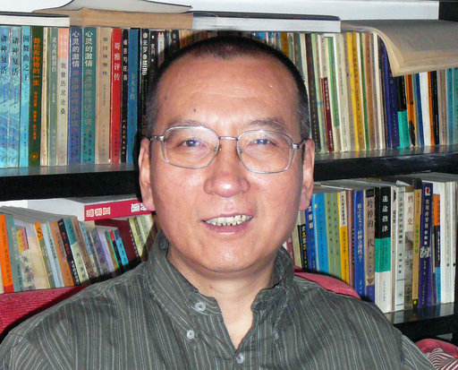FILE - In this April 2008 file photo shows Chinese dissident Liu Xiaobo as he poses for a photographer in China. The judicial bureau in the northeastern Chinese city of Shenyang says jailed Nobel Peace Prize laureate Liu Xiaobo has died of multiple organ failure Thursday