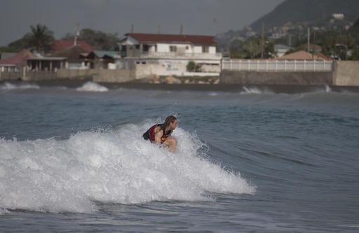 A man surfs at Wickie Wackie Beach before the arrival of Hurricane Matthew in Kingston