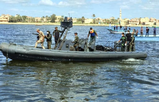 Egyptian coast guard and rescue workers bring ashore bodies recovered from a Europe-bound boat that capsized off Egypt's Mediterranean coast last week