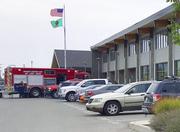 Cars and emergency vehicles are seen in front of Freeman High School in Rockford
