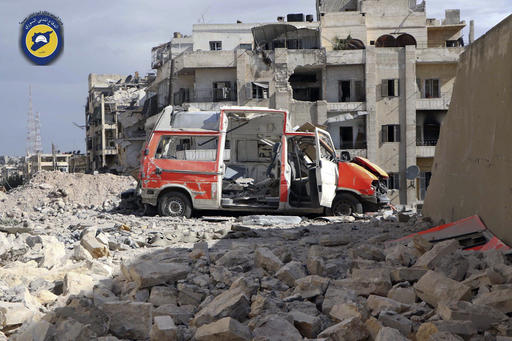 FILE - In this photo provided by the Syrian Civil Defense group known as the White Helmets