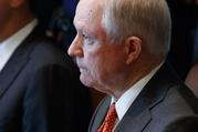 Attorney General Jeff Sessions listens as President Donald Trump speaks during a cabinet meeting in the Cabinet Room of the White House