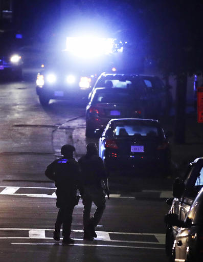 Police search for a suspect after a police shooting in the East Boston neighborhood of Boston