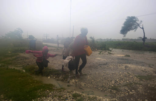 Residents head to a shelter in Leogane