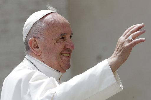 Pope Francis salutes at the end of his weekly general audience in St. Peter square at the Vatican