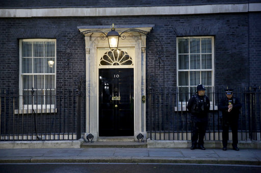 Police officers stand outside 10 Downing Street in London