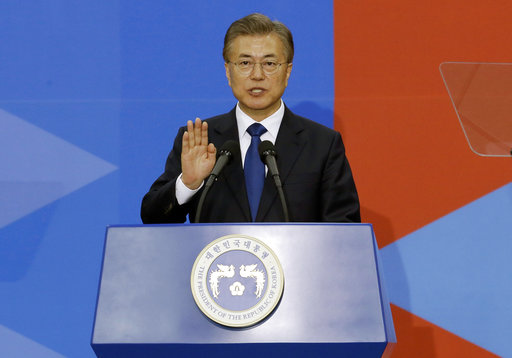 Newly elected South Korean President Moon Jae-in takes an oath during his inauguration ceremony at the National Assembly in Seoul