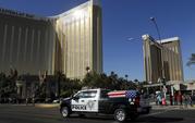 The funeral procession for Las Vegas police officer Charleston Hartfield passes the Mandalay Bay hotel on the Las Vegas Strip Friday