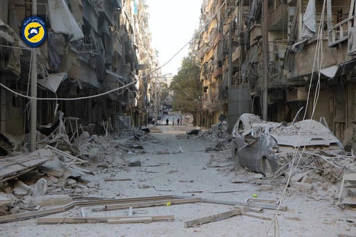 In this photo provided by the Syrian Civil Defense group known as the White Helmets