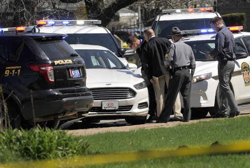 Pennsylvania State Police look over a car as they investigate the scene where Steve Stephens