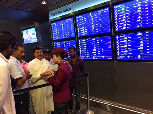 Passengers of cancelled flights wait in Hamad International Airport (HIA) in Doha