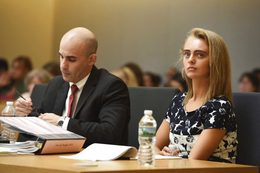 Defense Attorney Cory Madera makes notes as defendant Michelle Carter listens during her trail at Taunton Juvenile Court with attorney Joseph Cataldo in Taunton