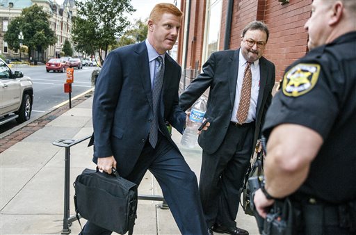 Former Penn State football assistant coach Mike McQueary arrives