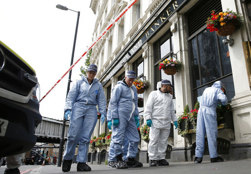 Forensic police investigate around the Borough Market and London Bridge area of London