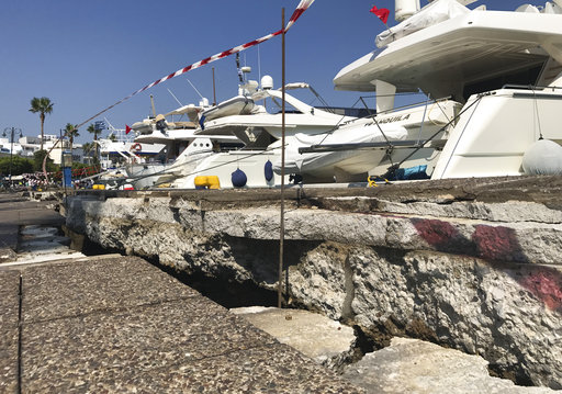 The broken quay wall is raised by several inches in the harbor after an earthquake in Kos on the island of Kos