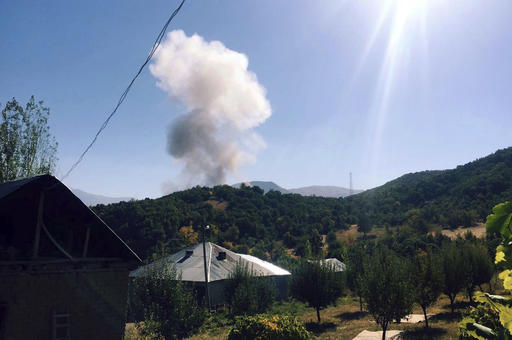 Smokes rise after Kurdish militants detonated a car bomb outside a military station in Semdinli near the border with Iraq