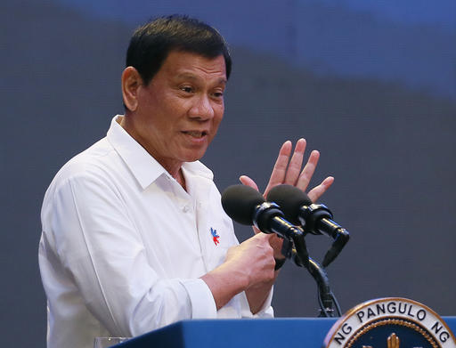 Philippine President Rodrigo Duterte gestures during his address to a Filipino business sector in suburban Pasay city south of Manila