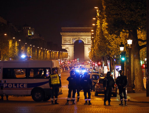 Police seal off the Champs Elysees avenue in Paris
