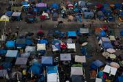 A large homeless encampment is formed in the Santa Ana Civic Center on Wednesday