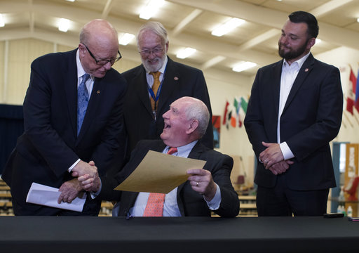 Agriculture Secretary Sonny Perdue shake hands with Senate Agriculture