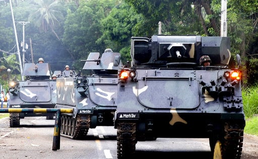 Tanks arrive at a military camp in Iligan city to reinforce Government troops who are battling Muslim militants who laid siege in Marawi city for over a week now Wednesday