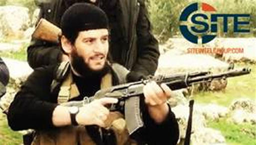 This undated militant image provided by SITE Intel Group shows Abu Muhammed al-Adnani