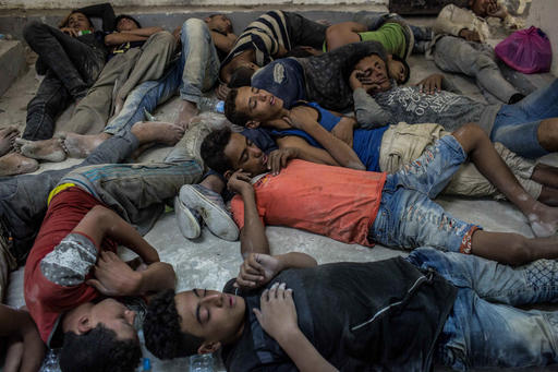 Young Egyptians detained at a police station sleep on the floor in Rosetta