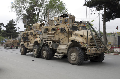 A damaged U.S. military vehicle is pictured at the site of a suicide attack in Kabul