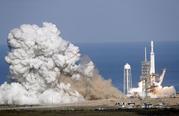 A Falcon 9 SpaceX heavy rocket lifts off from pad 39A at the Kennedy Space Center in Cape Canaveral