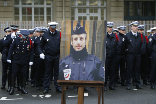 A portrait of killed police officer Xavier Jugele is seen in the courtyard of the Paris Police headquarters before an official homage