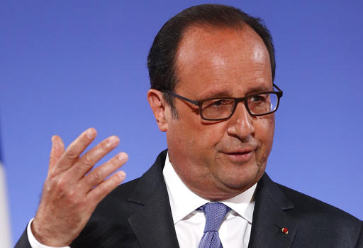 French President Francois Hollande gestures as he addresses French ambassadors