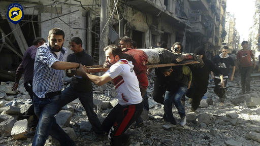 In this photo provided by the Syrian Civil Defense group known as the White Helmets