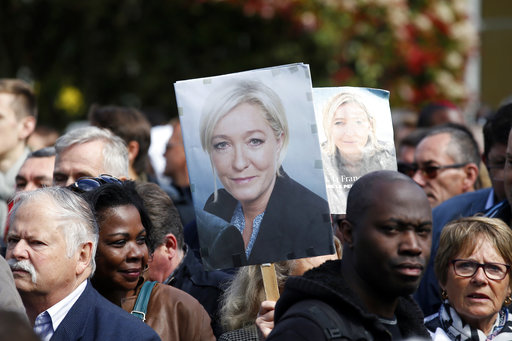 Supporters of far-right presidential candidate Marine Le Pen arrive at a campaign meeting