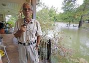 Jimmie Bradley speaks about the flooding in his neighborhood in Moss Bluff