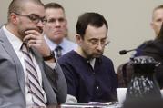 Larry Nassar sits with attorney Matt Newburg during his sentencing hearing Wednesday