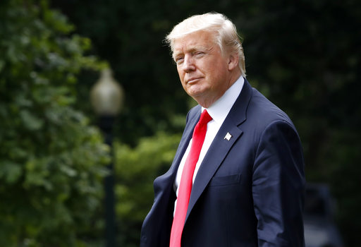 President Donald Trump walks toward the South Lawn of the White House to board the Marine One helicopter