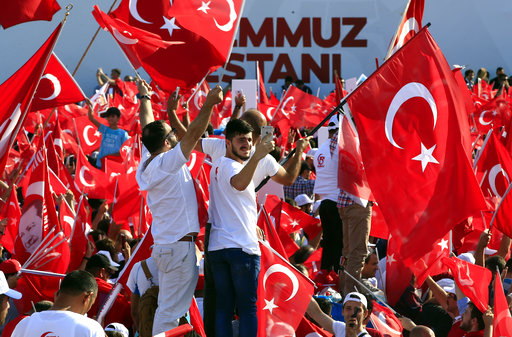 People take part in the "National Unity March" to commemorate the one year anniversary of the July 15