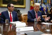 Treasury Secretary Steve Mnuchin listens as President Donald Trump speaks during a meeting on tax policy with business leaders in the Roosevelt Room of the White House