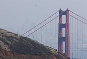 A seaplane flies over the Golden Gate Bridge Friday