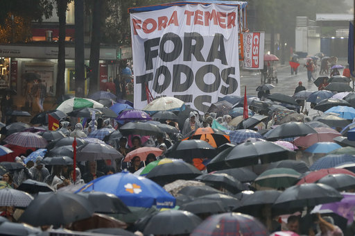 Demonstrators march against Brazil's President Michel Temer