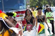 Dancers arrive in costume at the West Indian Day Parade on Monday