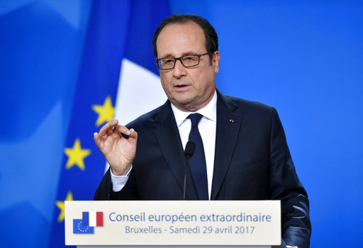 French President Francois Hollande talks to the media at a press conference after a round table meeting at an EU summit in Brussels on Saturday