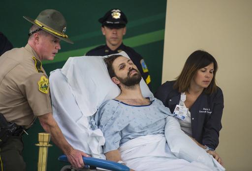 Steven Bourgoin is brought in to be arraigned in a makeshift courtroom at the University of Vermont Medical Center on five counts of second-degree murder in Burlington