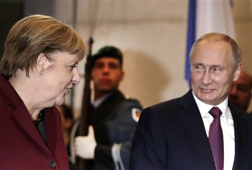 German Chancellor Angela Merkel welcomes the President of Russia Vladimir Putin for a summit with the leaders of Russia