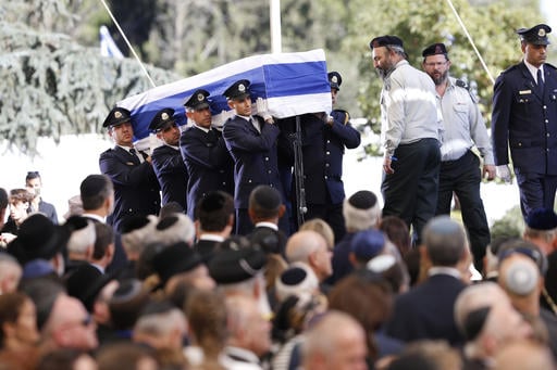 Knesset guards carry the flag-draped coffin during the funeral of former Israeli President Shimon Peres at the Mount Herzel national cemetery in Jerusalem