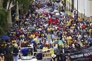 Demonstrators march to protest austerity measures in San Juan