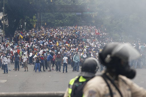 Opponents of President Nicolas Maduro march in Caracas