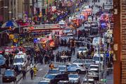 Law enforcement officials work following an explosion near New York's Times Square on Monday