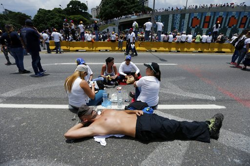 Opposition member shut down a main road during a protest against President Nicolas Maduro in Caracas