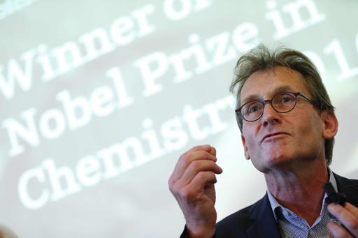 Dutch scientist  Bernard "Ben" Feringa gestures as he speaks during a press conference at the University of Groningen in the Netherlands